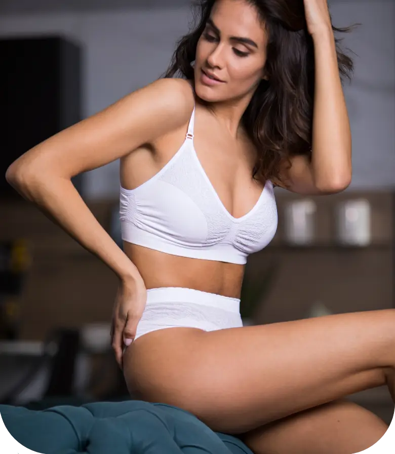 woman wearing Intimidea's bra, happy