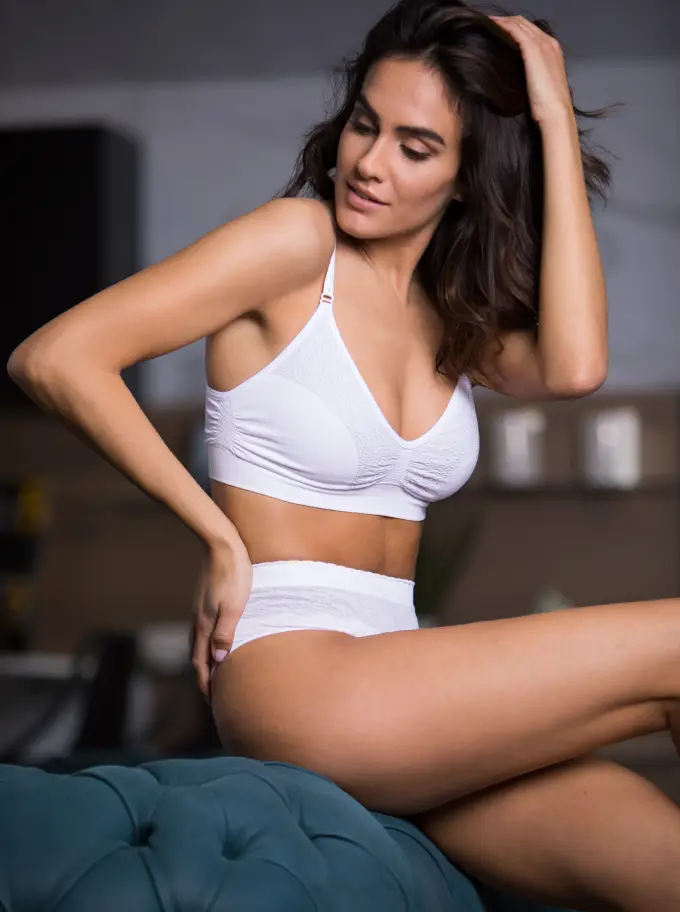 woman wearing Intimidea's bra, happy